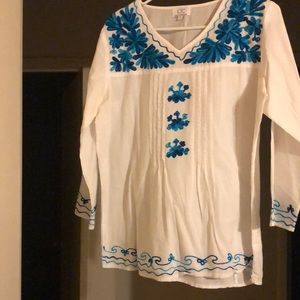 White shirt with blue flower design no damages no rips or stains only worn once!